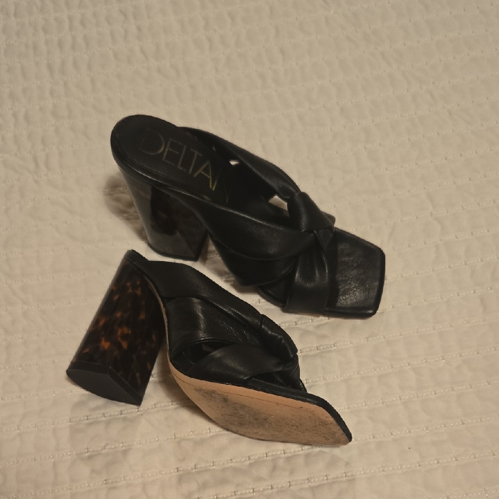 Delta Black Mules Sleek and Versatile